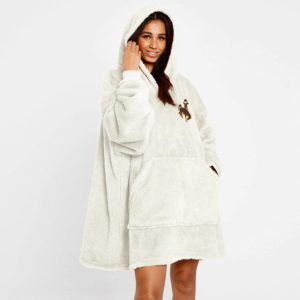 woman wearing oversized cream blanket hooded sweatshirt, design is embroidered brown bucking horse outlined in gold, kangaroo pocket on front