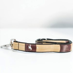 durable fabric pet leash with metal clip. fabric is brown and gold alternating, with University of Wyoming and bucking horses printed repeatedly