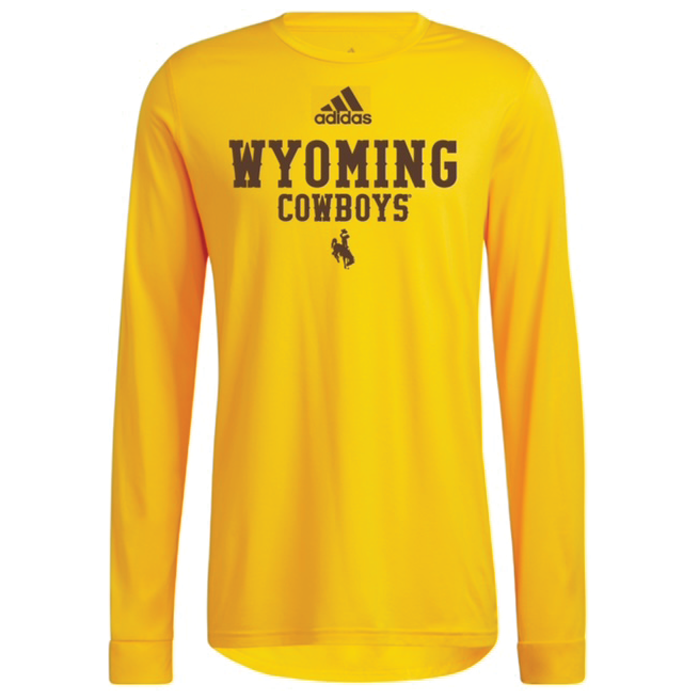 moisture wicking, gold long sleeved tee. Brown Adidas logo, slogan Wyoming Cowboys with bucking horse below printed on front of tee