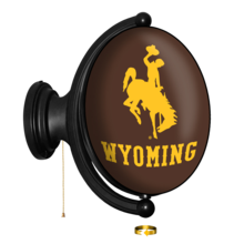 plastic, oval light with brown background and gold bucking horse and word wyoming on front. light is attached to black mount