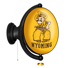 plastic, oval light with gold background and pistol Pete on front with word Wyoming below in brown. light is attached to black mount