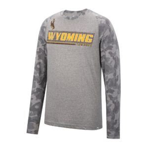 longlseeve t shirt with heather grey body color and grey camouflage sleeves. Wyoming printed on the front in gold with brown lines behind the words. cowboys printed smaller below in brown