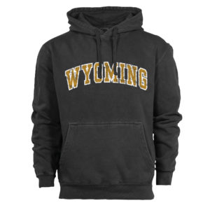 garment washed charcoal hooded sweatshirt with word Wyoming arced in the center of garment. Wyoming is distressed and printed in gold with white outline