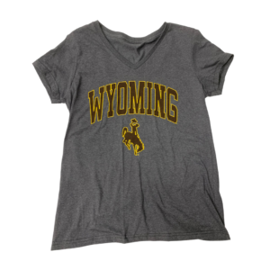 grey women's v-neck short sleeved tee. Arced Wyoming with bucking horse below printed in brown with gold outline