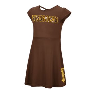 brown, toddler short sleeved dress. Word Wyoming outlined on front in gold, word Cowboys printed vertically down the side of skirt in gold