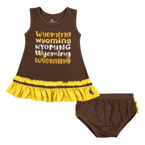 brown infant dress with brown bloomers. gold ruffles on hem of dress, and back side of bloomers. Word Wyoming repeated on front of dress in white and gold