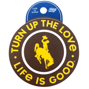 brown circle decal with words turn up the love and life is good printed in gold with bucking horse in the center