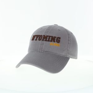 dark grey garment washed, adjustable hat. Word Wyoming embroidered in brown on front, with word alumni embroidered in gold below