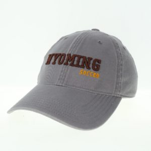 dark grey garment washed, adjustable hat. Word Wyoming embroidered in brown on front, with word soccer embroidered in gold below