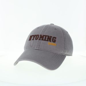 dark grey garment washed, adjustable hat. Word Wyoming embroidered in brown on front, with word rodeo embroidered in gold below