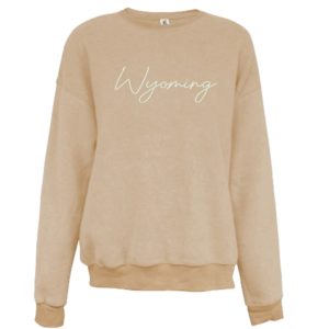 women's, oatmeal crewneck sweatshirt. Word Wyoming embroidered in cream on the front in small script lettering