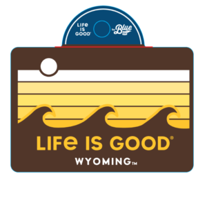 rectangular brown decal with wave design and slogan life is good Wyoming printed in gold and white
