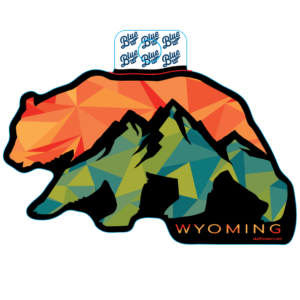 bear shaped decal with green and red mountains inside