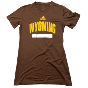 women's brown athletic short sleeved tee. Adidas logo and word Wyoming printed in gold, with a white bar printed below. design on front center of tee