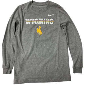 Nike brand grey long sleeved, design is white word Wyoming with gold line through it word Cowboys, gold bucking horse below, white Nike logo in left chest