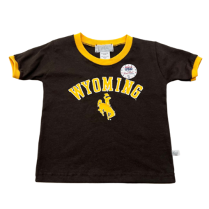 brown, toddler short sleeved tee. gold trim on neck and sleeves. Word Wyoming arced with bucking horse below printed in gold on front center of tee