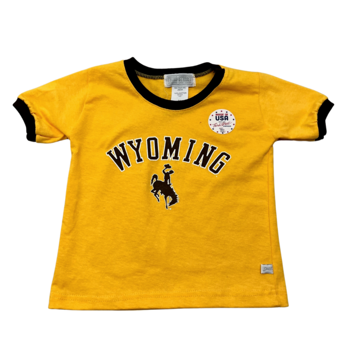 gold, toddler short sleeved tee. brown trim on neck and sleeves. Word Wyoming arced with bucking horse below printed in brown on front center of tee