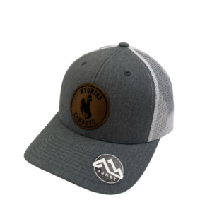 structured, mid profile hat with snapback closure. grey front, white mesh back. Leather Wyoming Cowboys patch with bucking horse on front of hat