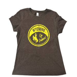 women's scoop neck brown short sleeved tee. circular gold design on front with slogan Wyoming and bucking horse inside