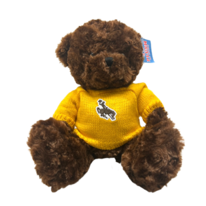 brown, plush bear. bear wearing gold sweater with brown bucking horse on front center