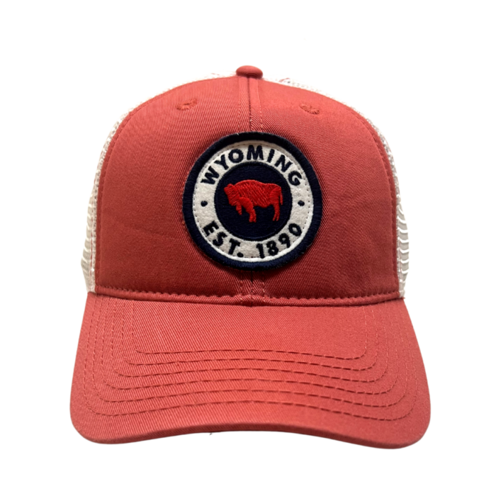 unstructured, adjustable hat. Red body, with white mesh back. Circle patch on front of hat with slogan Wyoming Est. 1886 and buffalo in navy