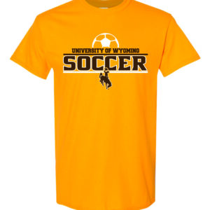 Gold short sleeved tee with slogan University of Wyoming Soccer on front in brown. Soccer logo above in white and brown bucking horse below slogan