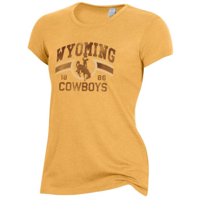 women's short sleeved tee in gold. Slogan Wyoming Cowboys printed distressed, on front of tee in brown and white. brown bucking horse in between slogan