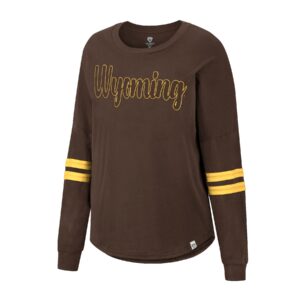 women's long sleeve brown tee with two gold stripes on sleeves, design is word Wyoming in gold outlined font in center of chest