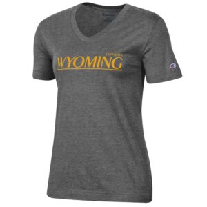 women's v neck, short sleeved tee in gray. On front of tee, word Wyoming in gold, gold line underneath, with word Cowboys printed smaller above,