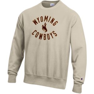 reverse weave, oatmeal crewneck sweatshirt. Design on front is word Wyoming arched above bucking horse word cowboys arched below, in brown with gold outline