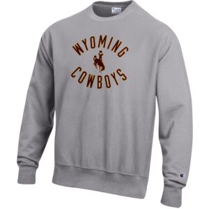 reverse weave, grey crewneck sweatshirt. Design on front is word Wyoming arched above bucking horse word cowboys arched below, in brown with gold outline