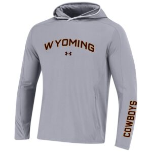 grey long sleeved tee. word Wyoming in brown with gold outlining in center, Under Armor logo in brown. word cowboys in brown with gold outlining on right sleeve