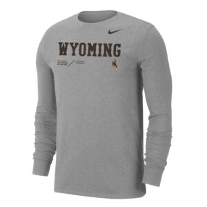 dark grey nike long sleeve tee, design on chest nike logo in brown above word Wyoming in brown with other Wyoming slogans below