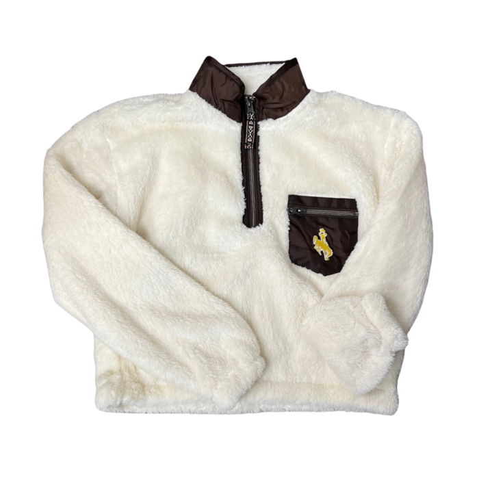 cream sherpa material 1/4 zippered jacket with brown trim. Brown front pocket on left chest, with gold bucking horse in the middle
