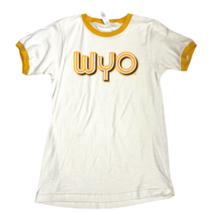 women's white short sleeved tee. gold trim on sleeves and neck. Slogan WYO printed in gold stripes with brown outline in retro font on front of tee