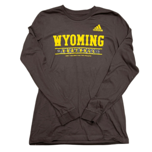 brown, Adidas brand long sleeved tee. Slogan Wyoming Football and bucking horse printed on front center of tee in gold