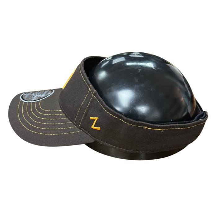 side of brown adjustable visor with gold stitching, gold Zephyr logo on side