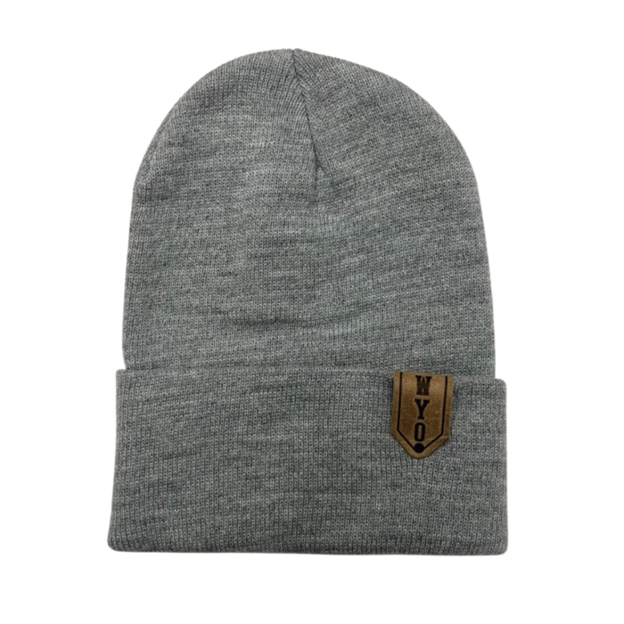 heather grey knit beanie with leather patch on side of cuff. Design is word WYO stamped into the leather patch