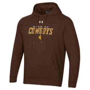 brown hooded sweatshirt, design is white Under Armour logo above word Wyoming in white, word cowboys in gold mesh print below, gold bucking horse beneath