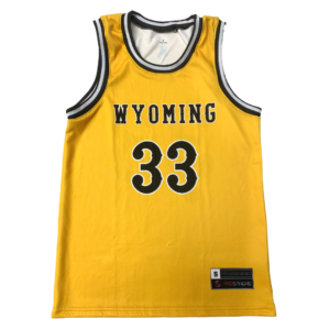 gold, sleeveless basketball jersey with brown and white trim neck. Word Wyoming with number 33 below printed on front center in brown with white outline