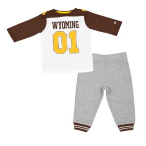 infant shirt and pants, pants are grey with brown bucking horse on left leg, shirt is white with brown sleeves, brown word Wyoming above gold numbers 01