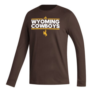 Adidas brown long sleeve tee, design is gold Adidas log between gold line above white stacked words Wyoming cowboys above gold line above gold bucking horse