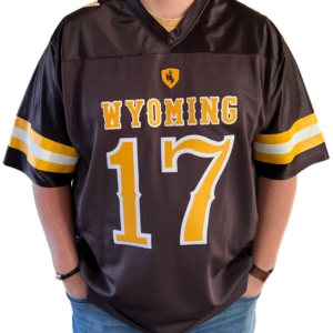 brown football jersey, gold and white stripes on sleeves, gold shield with brown bucking horse above gold word Wyoming above gold number 17