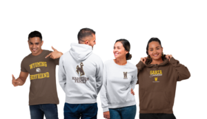 Four young adults posing wearing custom Cowboys apparel