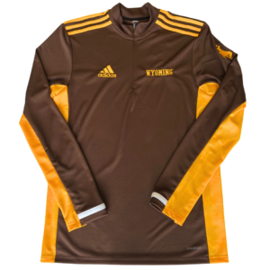 brown 1/4 zip pull over jacket. Gold accent fabric on shoulders, side seams and bottom of sleeves. Gold Adidas logo embroidered on right chest, word Wyoming embroidered on left chest. gold bucking horse on left sleeve