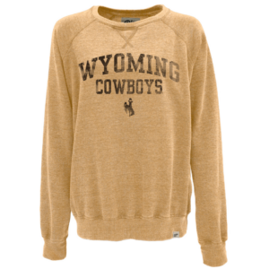 Women's faded gold crewneck sweatshirt, design is distressed brown word Wyoming above distressed brown word cowboys above distressed brown bucking horse