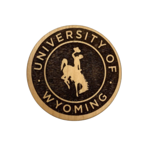 Alder wood round magnet, design is words university of Wyoming in lighter wood color surrounding bucking horse in lighter wood color, with a darker wood background