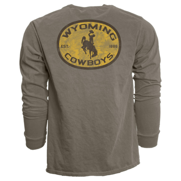 Back of light brown men's longsleeve, design is large gold circle brown outline with brown word Wyoming arched above brown bucking horse, brown word cowboys arched below, est. 1886 on sides