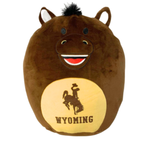 Character pillow, brown horse shaped with gold circle on front, brown bucking with brown word Wyoming in gold circle