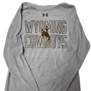 Under Armour men's long sleeve, design is brown logo above brown word outline Wyoming cowboys with brown bucking horse gold outline overlay